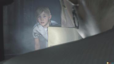 Shirley wears a white mottled blood-stained patient dress costume