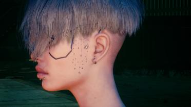 Indy's subtle face tattoo