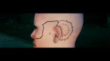 Indy's subtle face tattoo