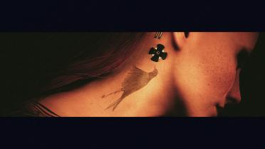 songbird face tattoo